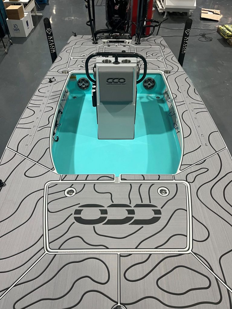 Skiff deck with a custom contour routing pattern